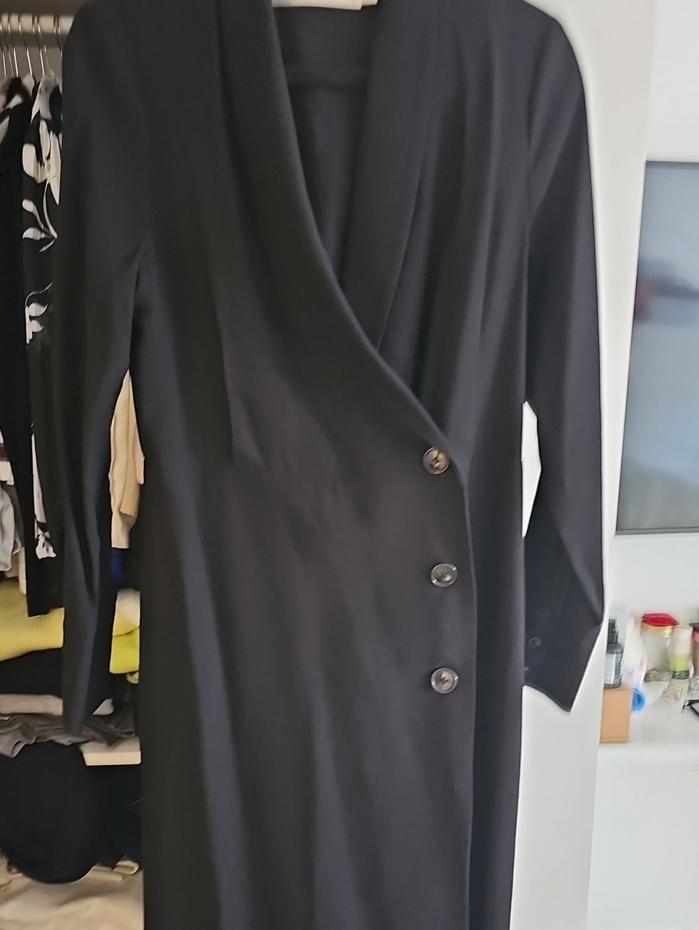 Sleek Black Long-Sleeve Faux-Wrap Dress with Button Detail